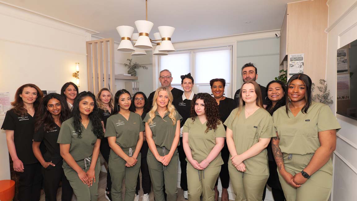 Friendly dentist welcoming patients at Church View Dental in Upminster